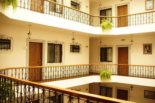a row of balconies in a building with plants at Vista Express Morelia by Arriva Hospitality Group in Morelia