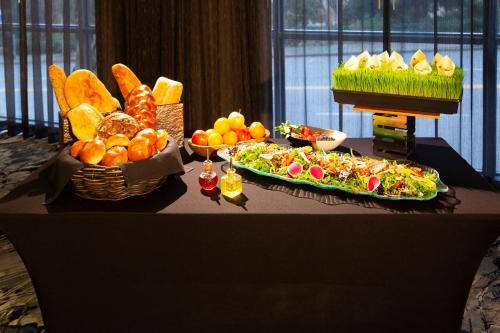 a table topped with lots of different types of food at Silver Cloud Hotel - Seattle Broadway in Seattle