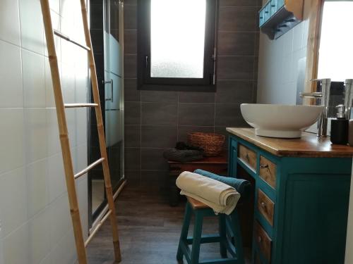 a bathroom with a sink and a mirror and a ladder at les roches du Cabellou 150M de la mer in Concarneau