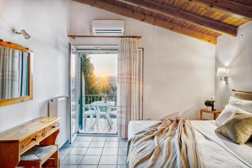 Säng eller sängar i ett rum på Villa Eftichia Hotel Apartments & Studios