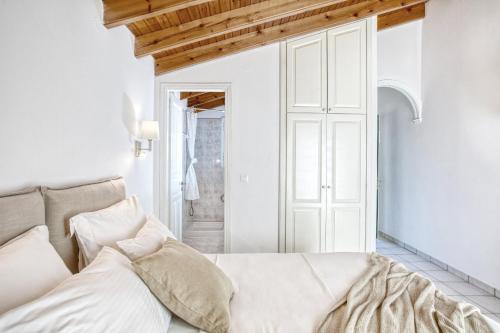 Ένα ή περισσότερα κρεβάτια σε δωμάτιο στο Villa Eftichia Hotel Apartments & Studios