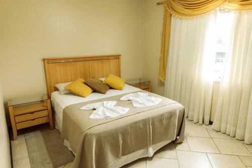 Katil atau katil-katil dalam bilik di Pousada Homestay Jaraguá Do Sul