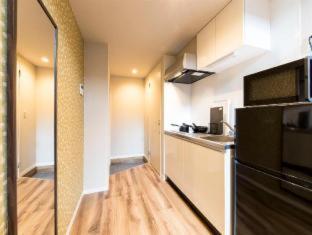 Una cocina o zona de cocina en TRIP POD CHIYO A