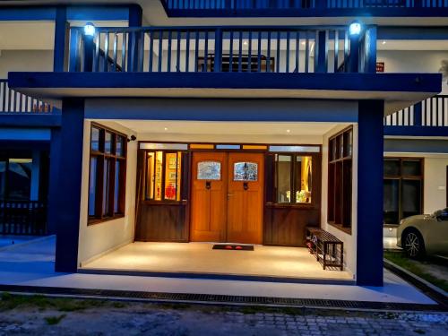 a house with a front door with lights on at Kairos Villa in Seremban