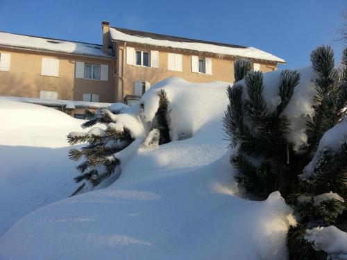 a pile of snow in front of a building at Bel Horizon in Le Chambon-sur-Lignon