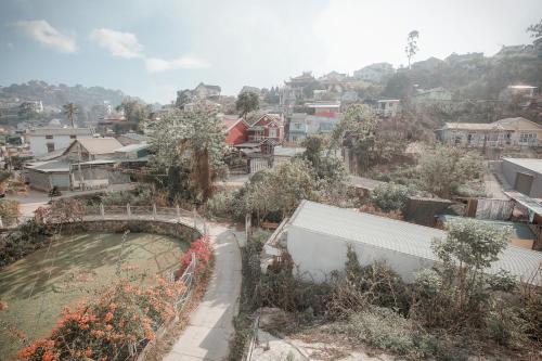 a view of a city with a bridge and buildings at Homestay BỒ CÔNG ANH in Da Lat