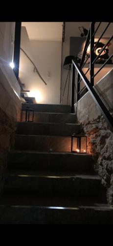 a set of stairs in a building with a light at jaccuzi & spa des caves Stanislas in Nancy