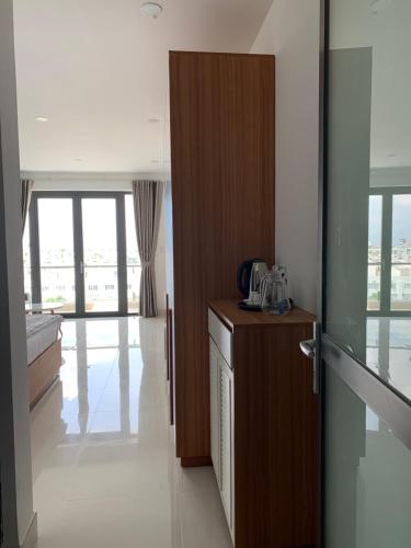 a room with a kitchen with a door to a room at New studio 201 - District 9 in Ho Chi Minh City