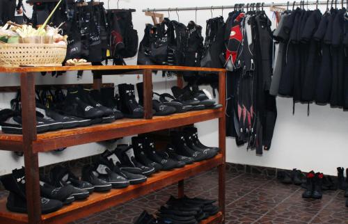 a bunch of shoes on shelves in a store at Scuba Tribe Bali dive-resort in Tulamben