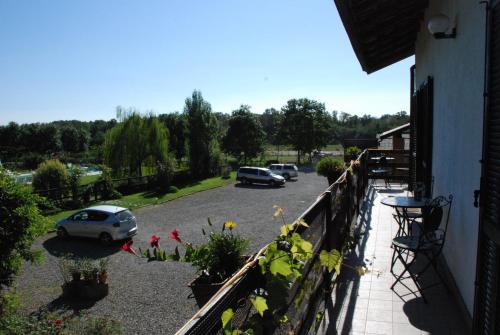 a balcony with cars parked in a parking lot at Agriturismo Fano's Farm in Suno