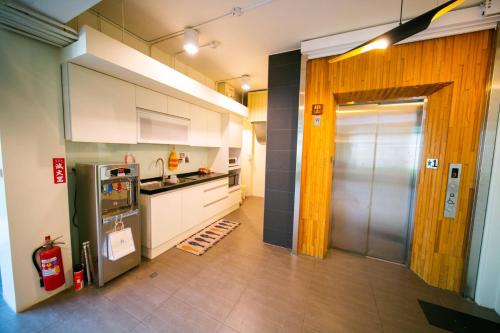 Virtuvė arba virtuvėlė apgyvendinimo įstaigoje 客旅家青年旅館 Travelers Plus