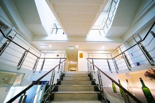 a staircase in a building with skylights at 客旅家青年旅館 Travelers Plus in Chiayi City