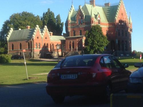 a car parked in front of a large building at Bergsviksvägen 5, Munkedal in Munkedal