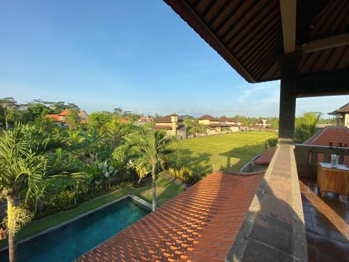 a view from the roof of a house with a swimming pool at Rumah Dadong in Ubud
