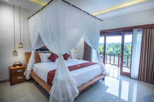 Łóżko lub łóżka w pokoju w obiekcie Mahadana Ubud