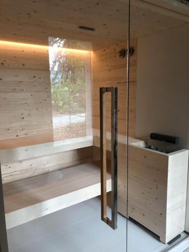 a sauna with a window in a wooden cabin at Villa San Liberale - Suites & Wellness - Villa Veneta in Feltre