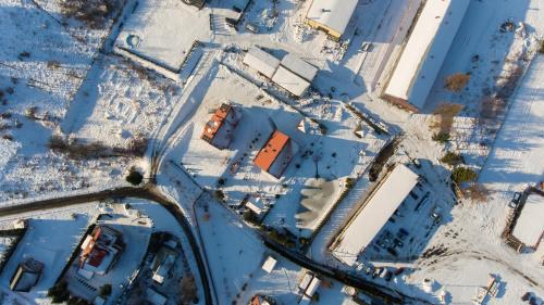 an overhead view of a group of buildings in the snow at Apartamenty pod Gromadzyniem in Ustrzyki Dolne