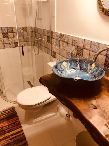 a bathroom with a sink and a toilet at Club Thermal Village Cegled in Cegléd