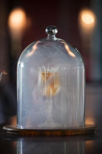 a glass cloche on top of a table at Taj Palace, New Delhi in New Delhi