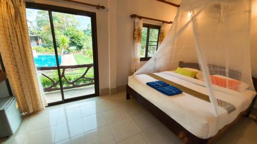 Un ou plusieurs lits dans un hébergement de l'établissement Tree Tops River Huts