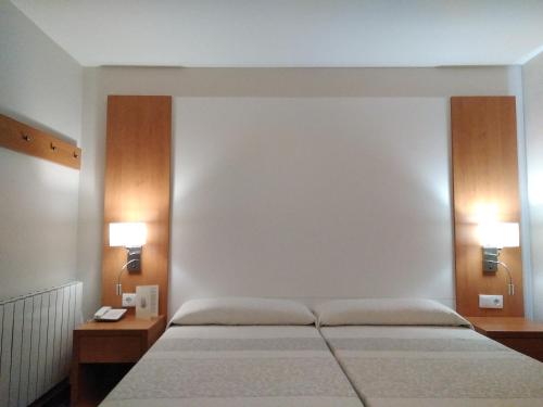 Ein Bett oder Betten in einem Zimmer der Unterkunft Hotel Europa