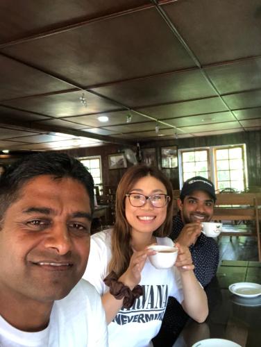 a group of people sitting at a table drinking coffee at Kandyan Lounge in Kiribatkumbura