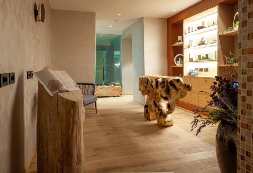 a lobby with a statue of a cow on the floor at Asiago Sporting Hotel & Spa in Asiago