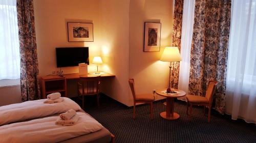 Tempat tidur dalam kamar di Hotel Altberesinchen