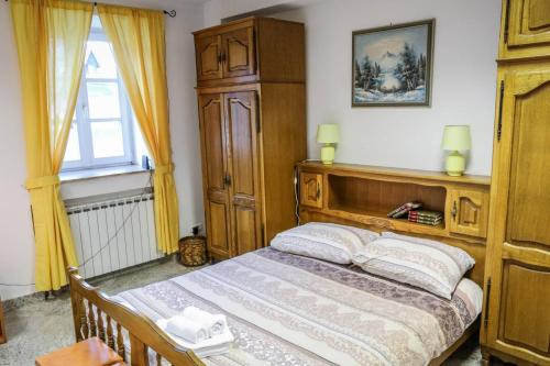 Кровать или кровати в номере Apartman Rudi
