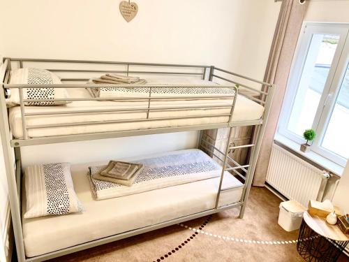
a bed room with two bunk beds and a window at New Hostel Berlin Mitte in Berlin
