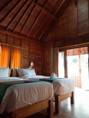 מיטה או מיטות בחדר ב-KKorok Hill Cottage