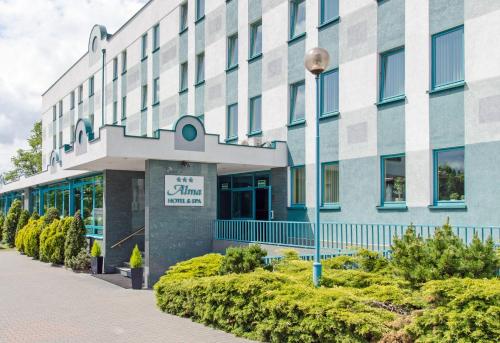 een gebouw met een bord ervoor bij SPA Barlinek, Hotel Alma & SPA - UWAGA - styczen do marzec 2026 basen nieczynny! in Barlinek