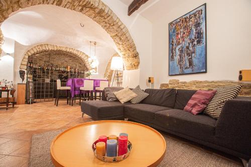 a living room with a couch and a table at Casa Cristina Bed&Breakfast in Ripabottoni