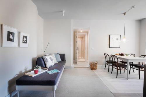 a living room with a couch and a table at Sands Hotell in Sandhamn