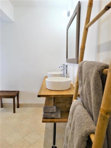 a bathroom with a sink and a mirror at Château MontPlaisir charming b&b in Provence in Valréas
