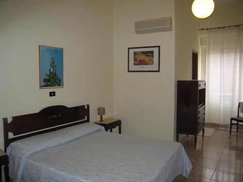 Postel nebo postele na pokoji v ubytování Hotel Touring