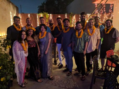 a group of people posing for a picture at a party at The Desire Hostel in New Delhi