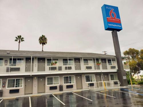 a building with a sign in front of it at Studio 6-National City, CA - Naval Base San Diego in National City