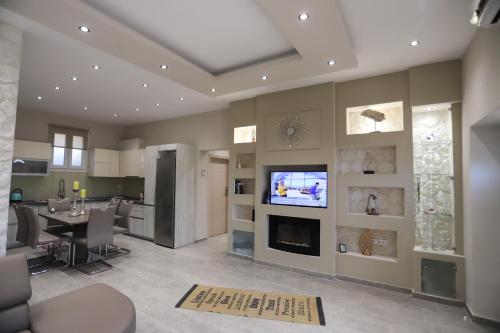 Kuchyň nebo kuchyňský kout v ubytování Olive Grove Deluxe apartment