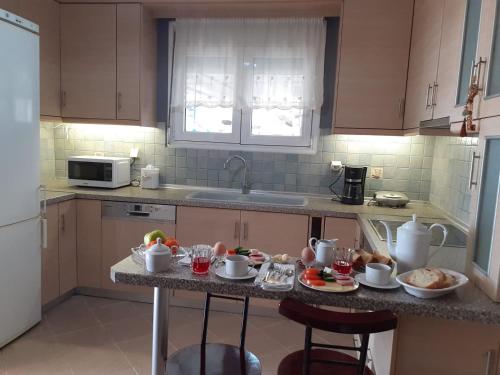Η κουζίνα ή μικρή κουζίνα στο Seaside Deluxe Apartment