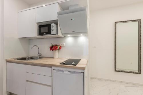 Kuchyň nebo kuchyňský kout v ubytování Holiday apartments Stobrec