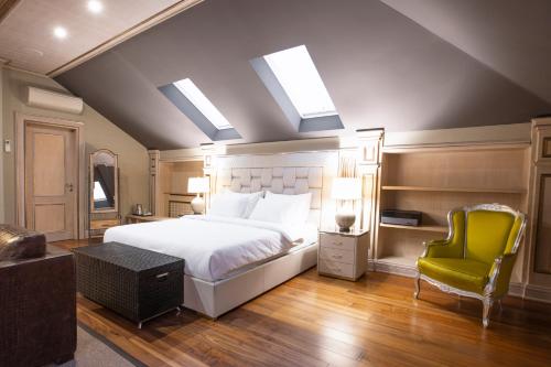 A bed or beds in a room at Eclat Luxury Hotel