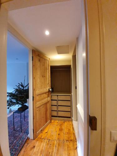 an open door to a bedroom with a closet at LE 41 AVENUE FOCH in Luchon