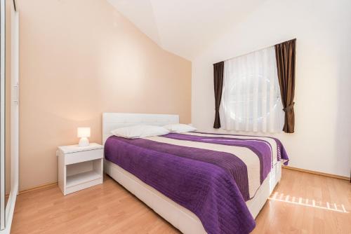 Posteľ alebo postele v izbe v ubytovaní Apartments Danijela 1