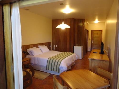 Ένα ή περισσότερα κρεβάτια σε δωμάτιο στο Hotel Passarim