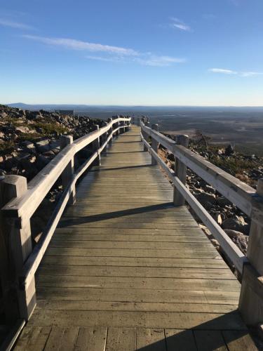 a boardwalk over the ocean on a beach at Levinlento in Levi