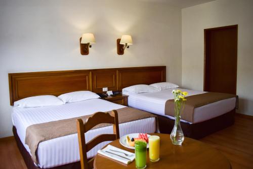 Tempat tidur dalam kamar di Hotel de Mendoza