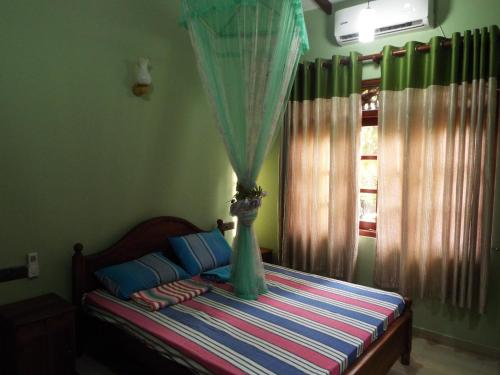Posteľ alebo postele v izbe v ubytovaní Ceylon Epic Villa