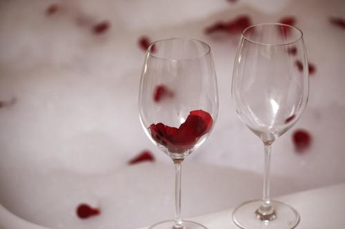 two wine glasses with a heart inside of them at Deluxe Jacuzzi Apartment by LIUKSAI in Klaipėda