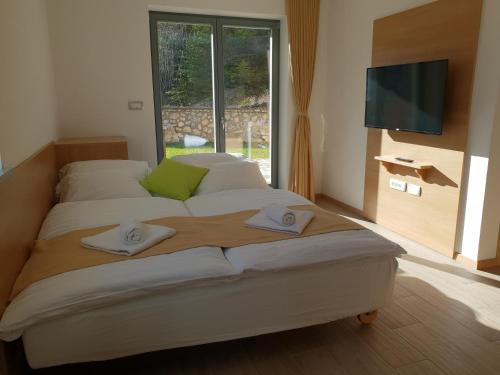 Llit o llits en una habitació de Apartments Vila Darja